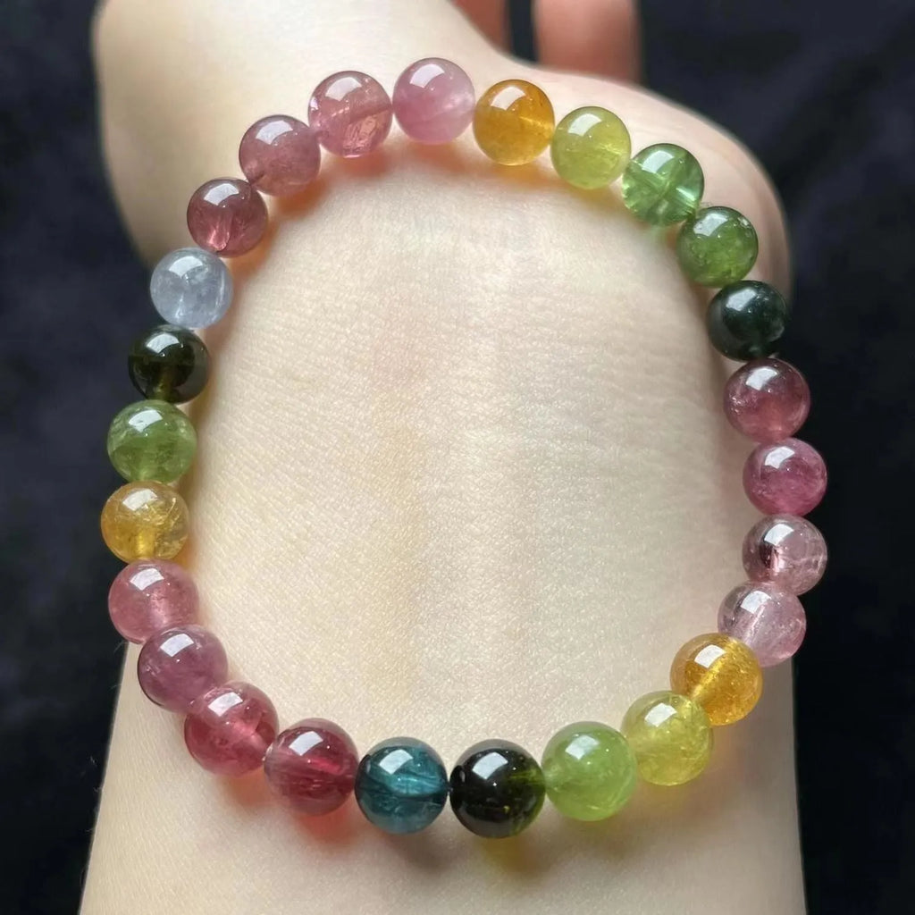 Coloured tourmaline bracelet with four-leaf clover pearl charm and geometric drop beads
