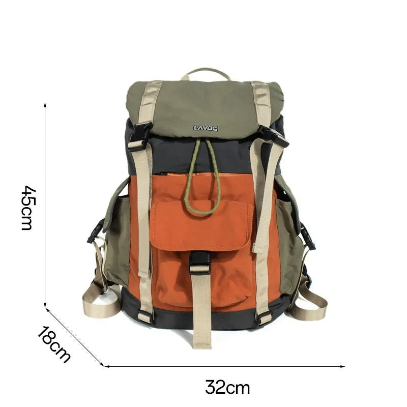 Orange and green contrast colour large outdoor backpack with multiple compartments on a neutral background.