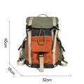 Orange and green contrast colour large outdoor backpack with multiple compartments on a neutral background.