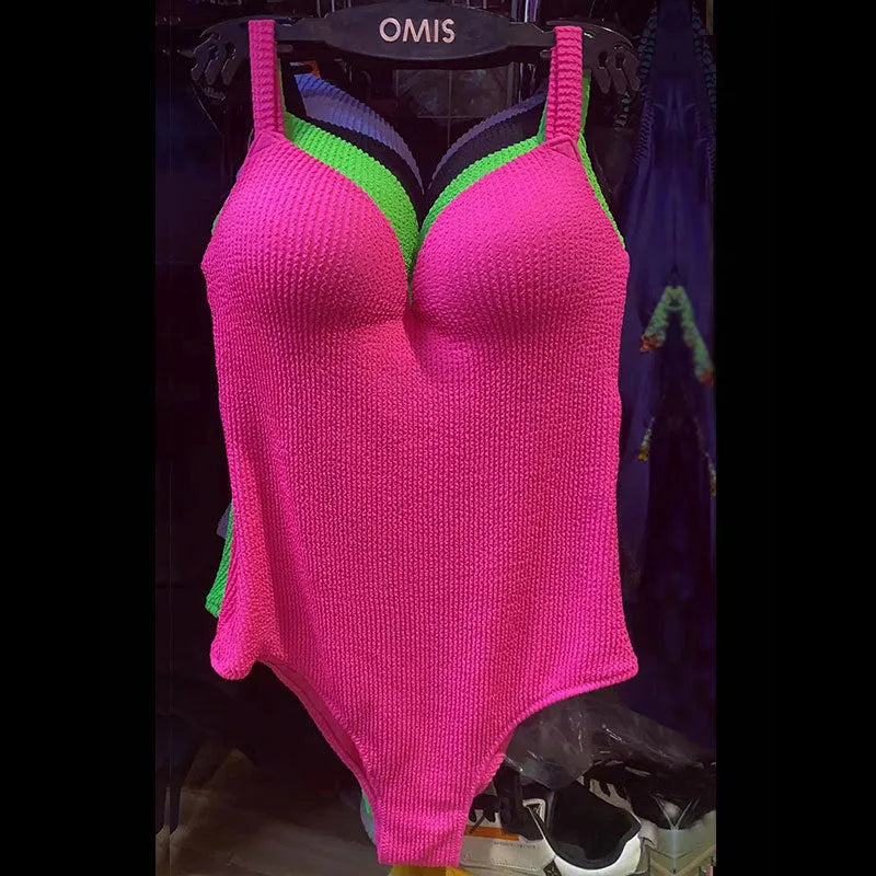 Women's sleeveless one-piece swimsuit in a striped design, shown in one of five available colours.