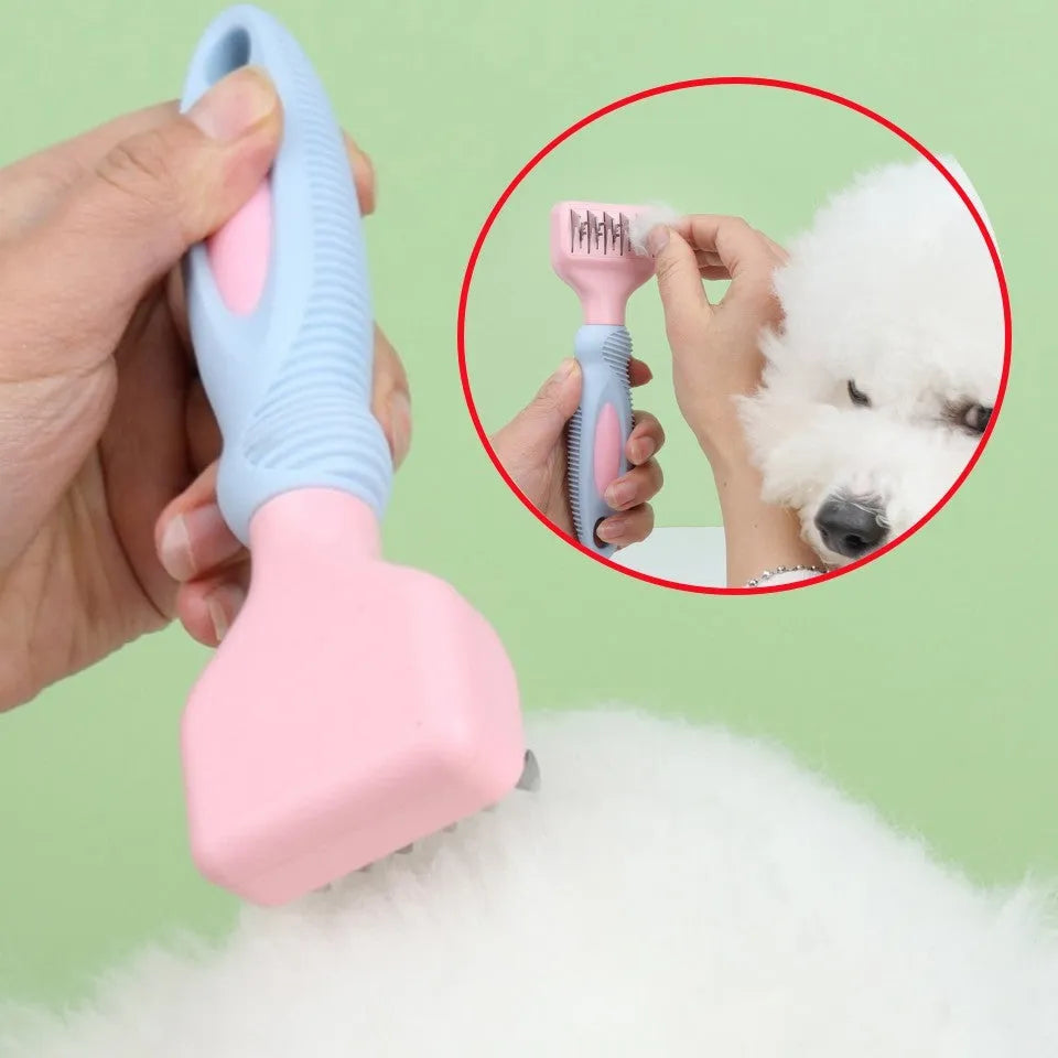 Pink dual-sided dog grooming comb with stainless steel blade and rotating ball-tip massage brush.