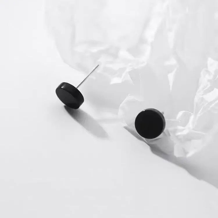 S999 sterling silver flat ear bone studs in geometric round design, showing silver and black colour options