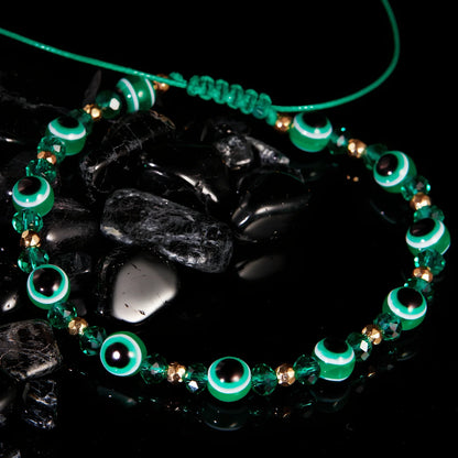 Adjustable crystal bead bracelet with blue eye design on braided rope, fits 15-19cm wrists