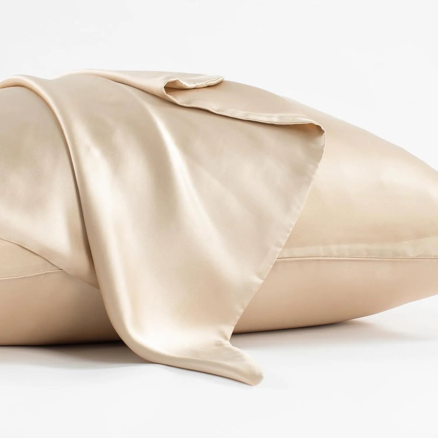 Dark grey mulberry silk pillowcase with envelope closure, shown in a modern bedroom setting.