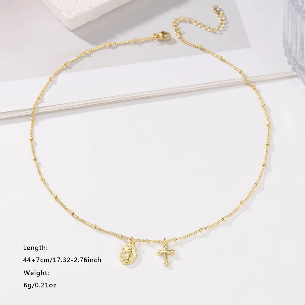 Gold geometric pendant necklace featuring the Virgin Mary on a chain.