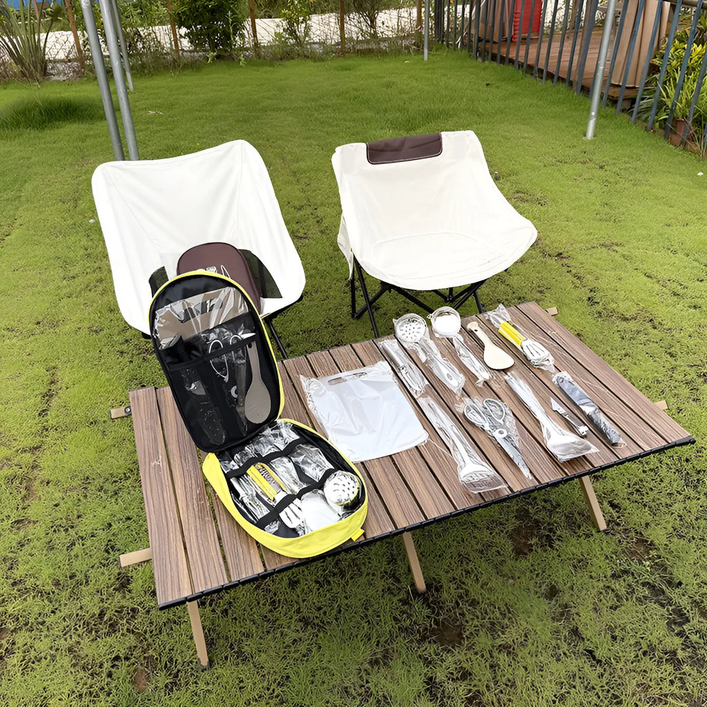 Brown portable storage bag containing a 12-piece stainless steel picnic kitchenware set.