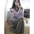 Purple women's sleeveless blouse with hollow out detail and princess sleeves, laid flat.