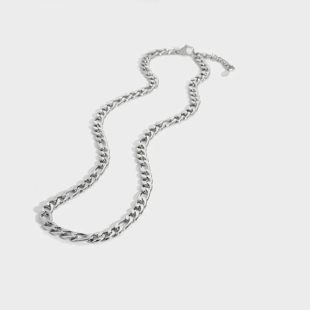 Gold electroplated stainless steel necklace with geometry pendant on white background