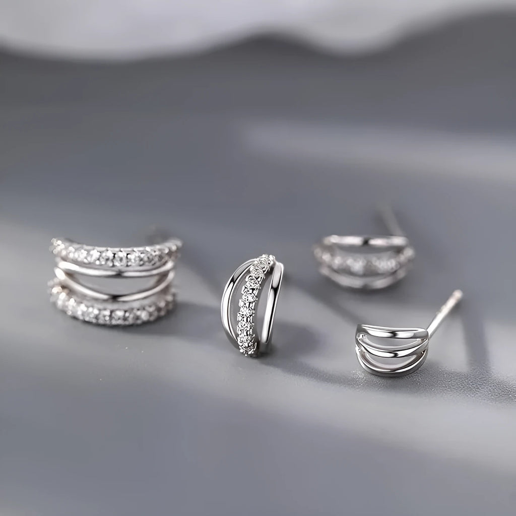 A pair of geometric-style earrings made from 925 silver with an electroplated finish, shown in large, medium, and small size options.