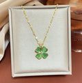 Titanium steel golden clavicle chain with geometric four-leaf flower design on unisex display
