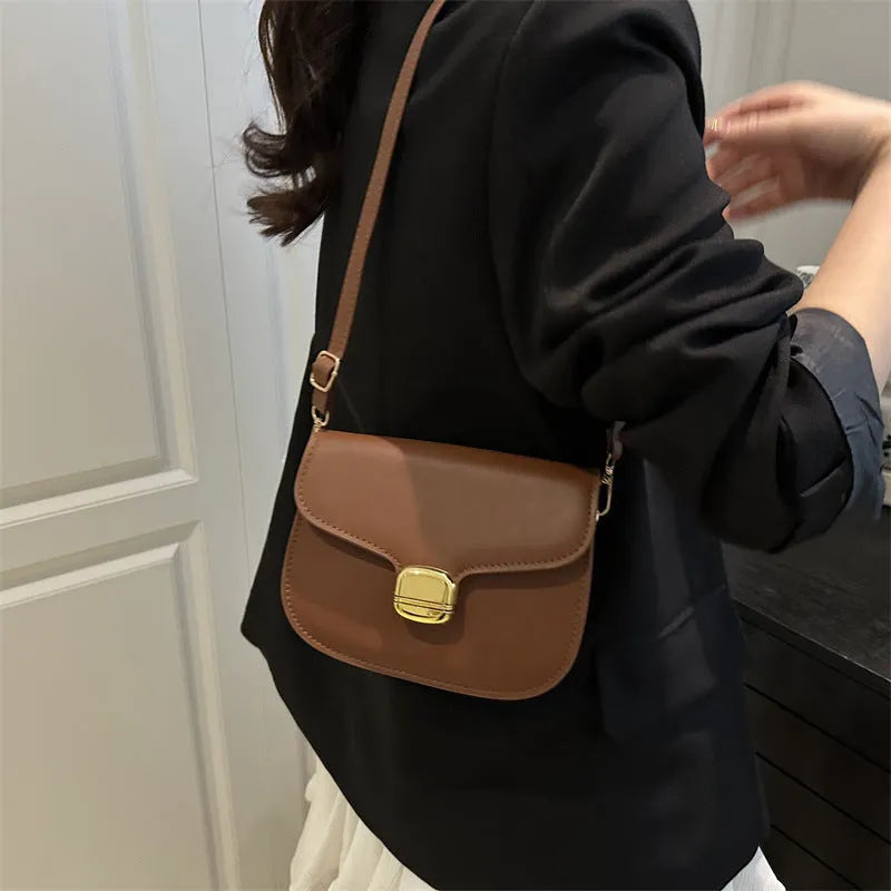 Simple PU leather women's handbag with interior zippered compartment and mobile phone pocket