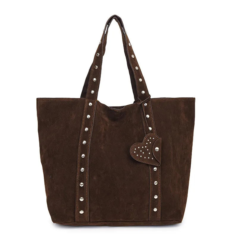Black PU leather tote bag with double shoulder straps, showing interior sandwich pocket organiser.