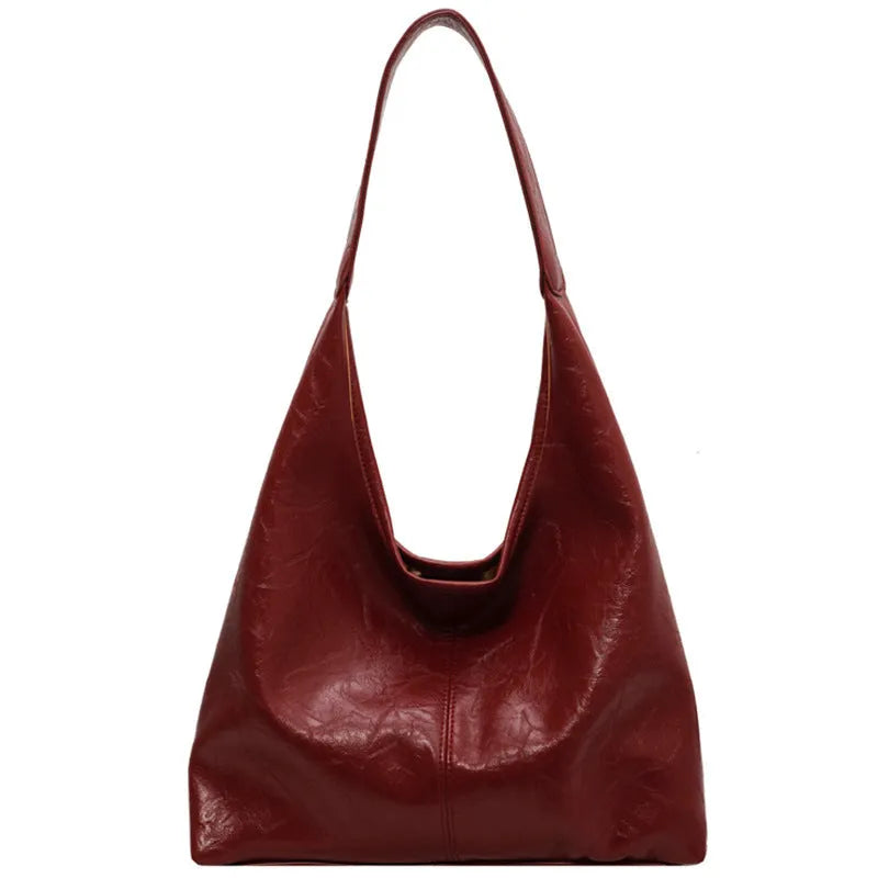 Soft PU leather large capacity shoulder bag in street style with sandwich pocket.