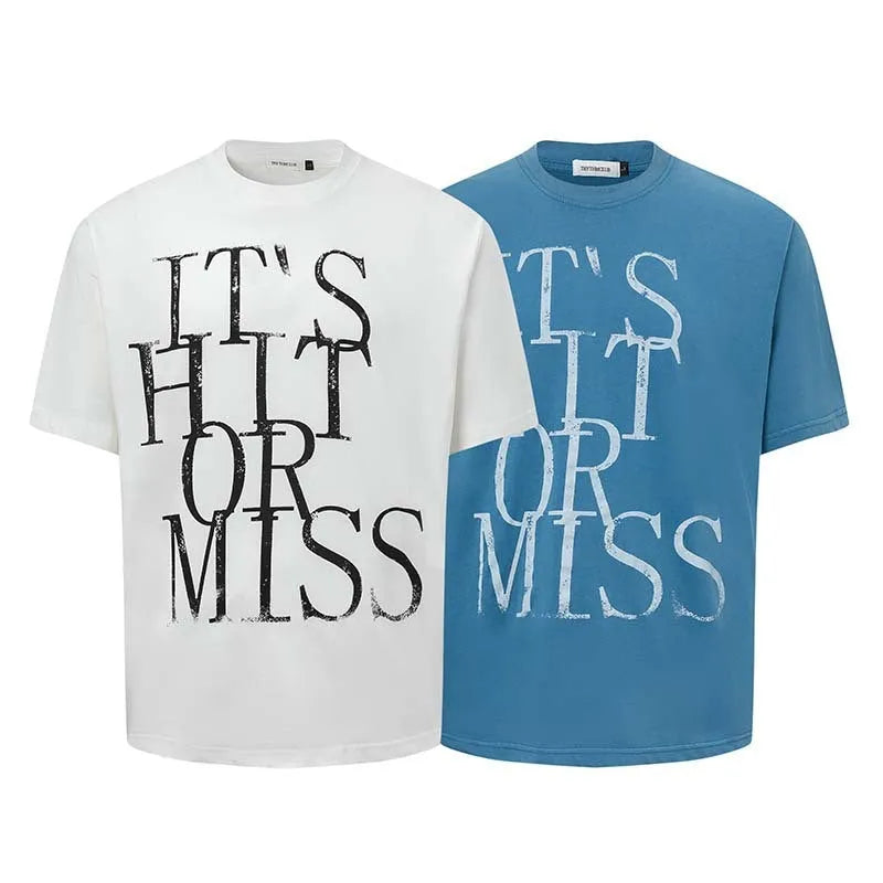 Man wearing a blue loose-fit cotton blend T-shirt with a retro white letter print design on the chest.