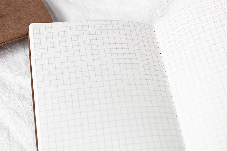 Travel cowhide diary refill inner core showing 11x21cm size and saddle stitch binding