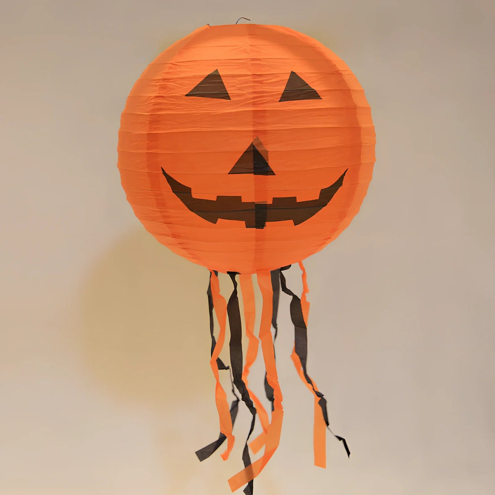60cm orange inflatable pumpkin decoration with black spider attached for Halloween displays