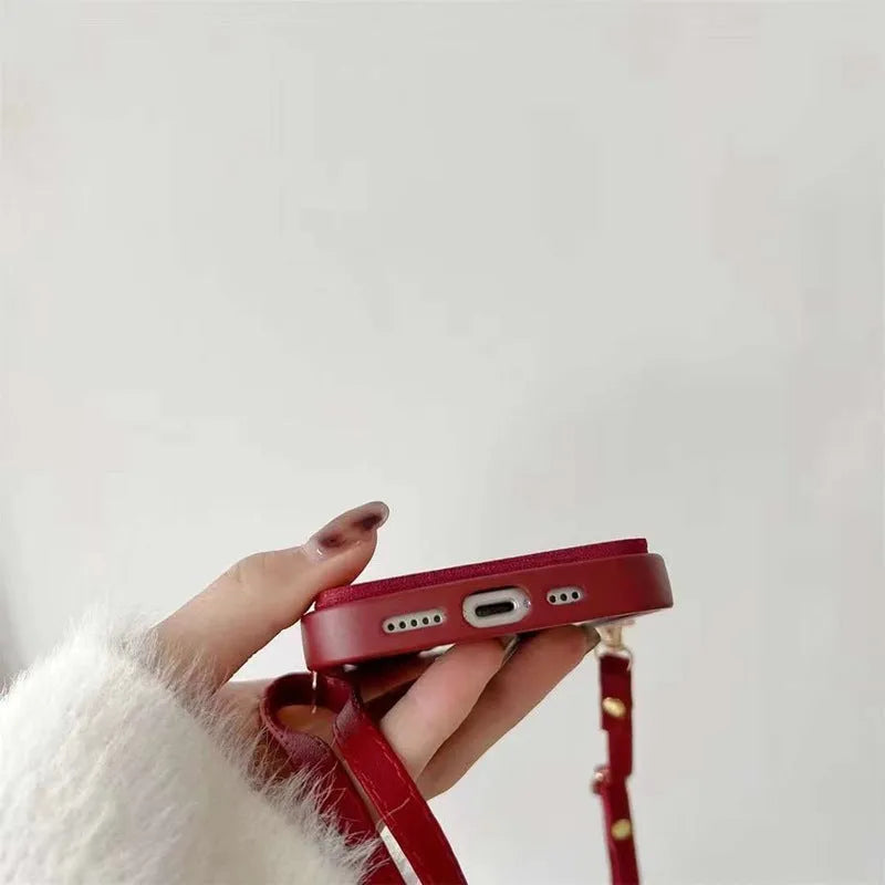 Red TPU crossbody card holder with lanyard for iPhone 15 showing diamond plaid pattern and rear card slot