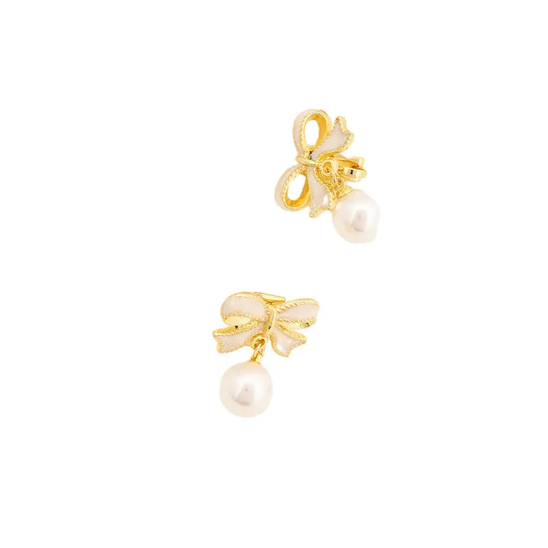 Alloy bow shape drop oil ear studs with electroplating finish in aurora white colour