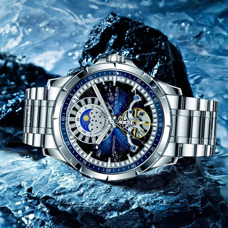 Men's silver and blue automatic mechanical watch with stainless steel strap on wrist