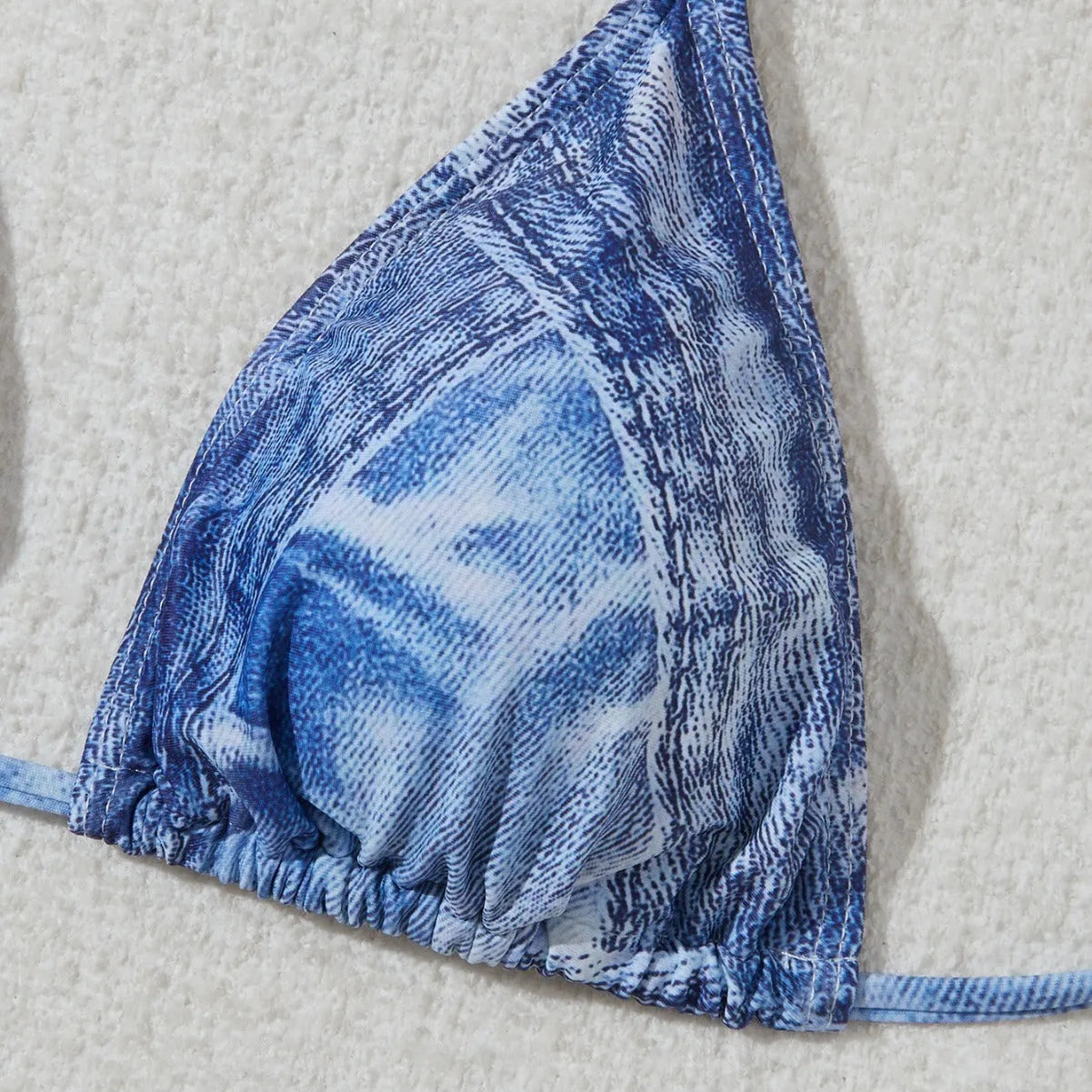 Denim blue printed bikini set with criss-cross straps on the top.