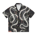 Short sleeve Cuban collar shirt with a snake bone pattern print in a loose fit.
