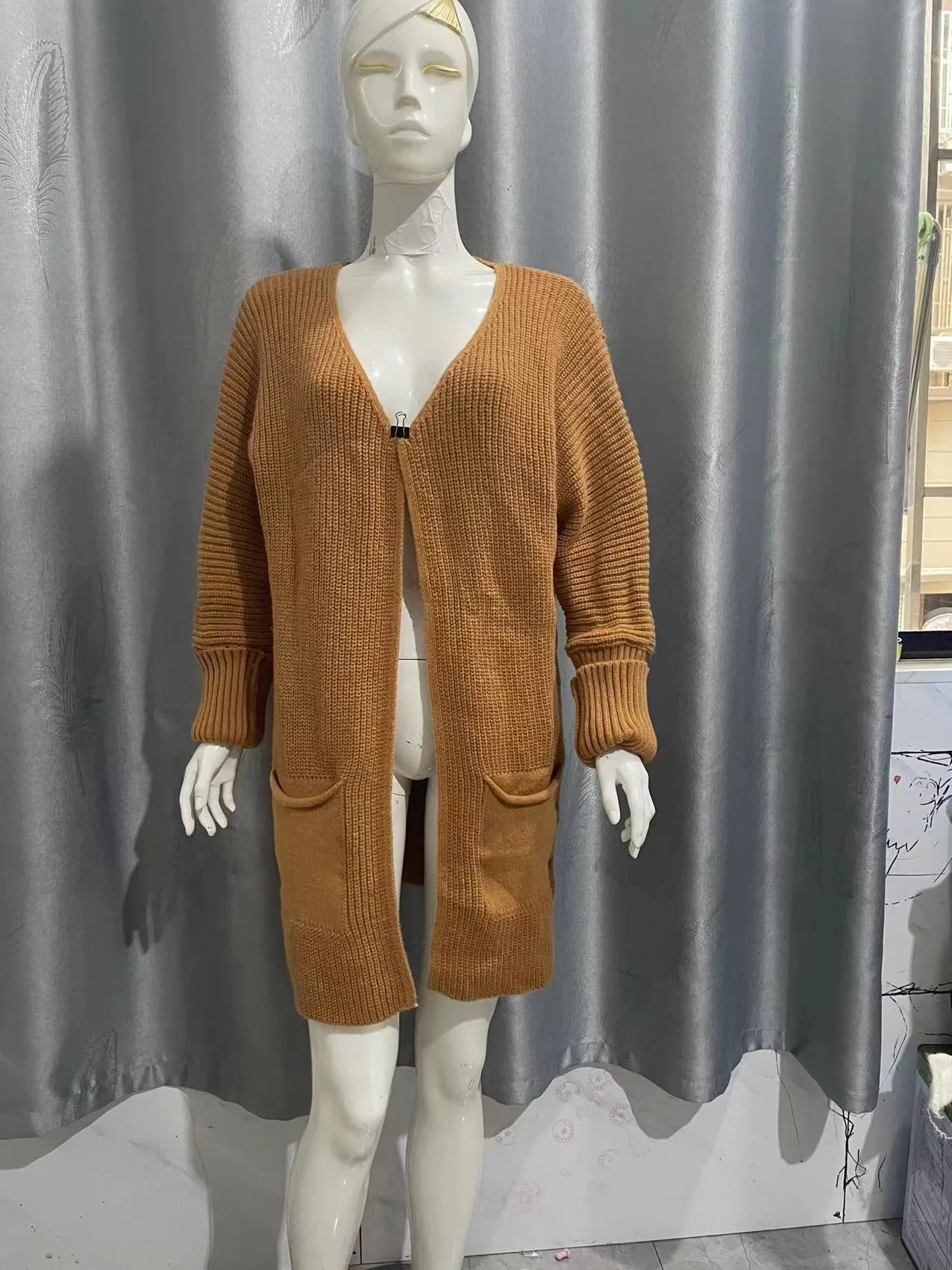 Long yellow camel jacket with loose pockets for stylish and practical wear