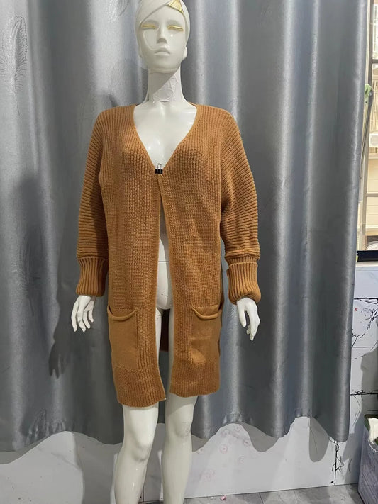 Long yellow camel jacket with loose pockets for stylish and practical wear