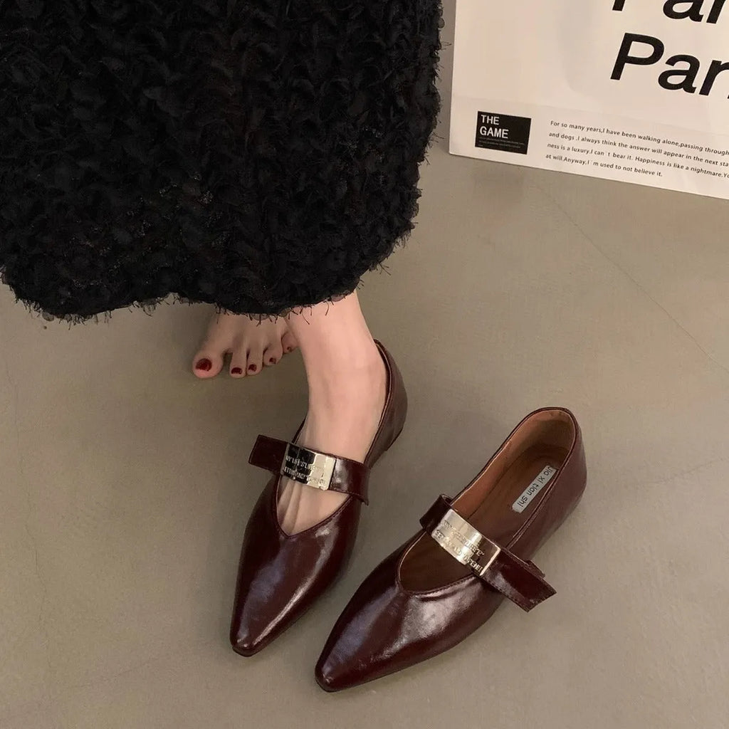 Women's silver Mary Jane shoes with pointed toe, buckle fastening, and low heel