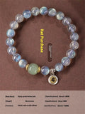 Close-up of an 8mm Moonstone crystal bracelet showing a detailed Thousand-Hand Kwan-yin mouse design.
