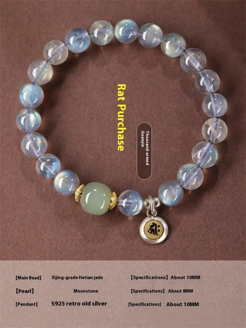Close-up of an 8mm Moonstone crystal bracelet showing a detailed Thousand-Hand Kwan-yin mouse design.