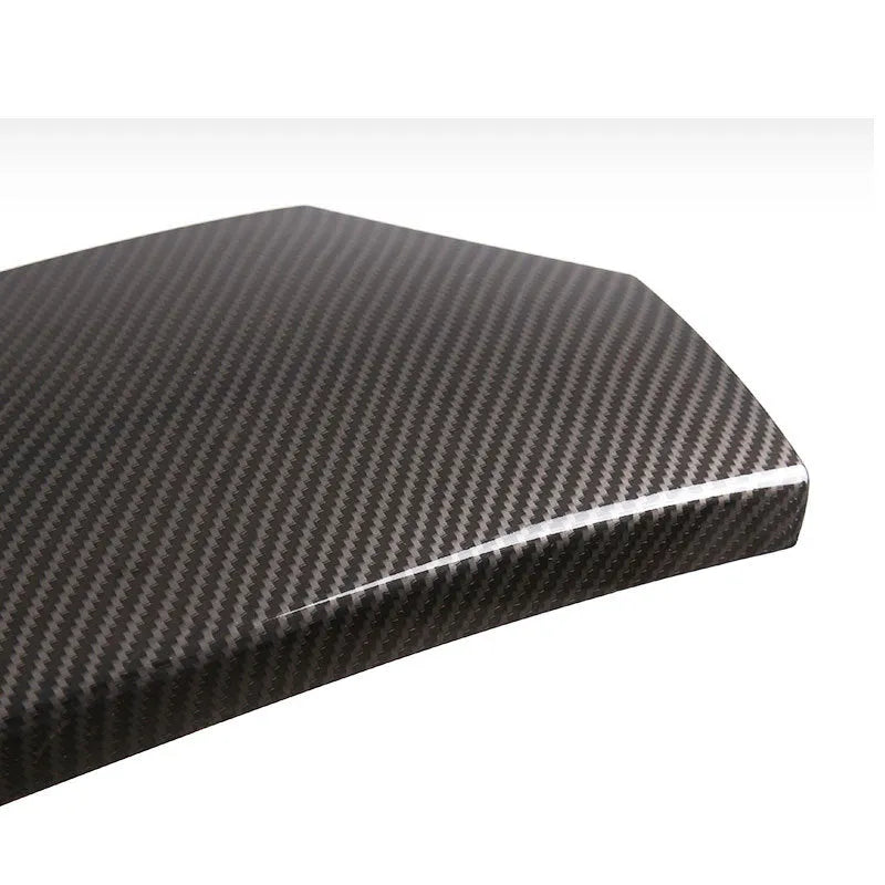 Three ABS armrest box protective covers with carbon fibre weave pattern showing polished surface