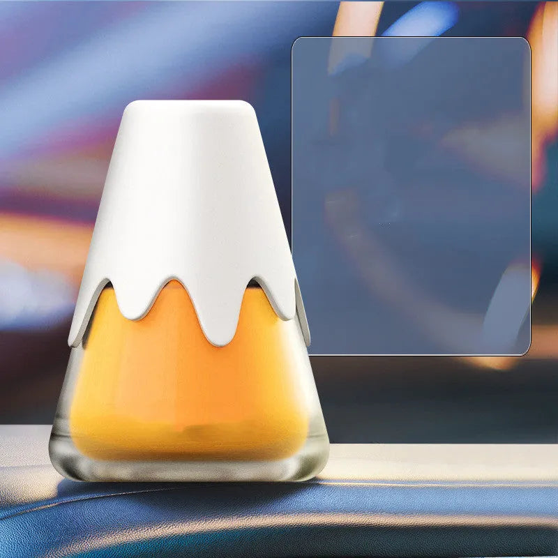 Glass car aromatherapy unit with snow mountain cup design measuring 9.10 by 6.9 cm