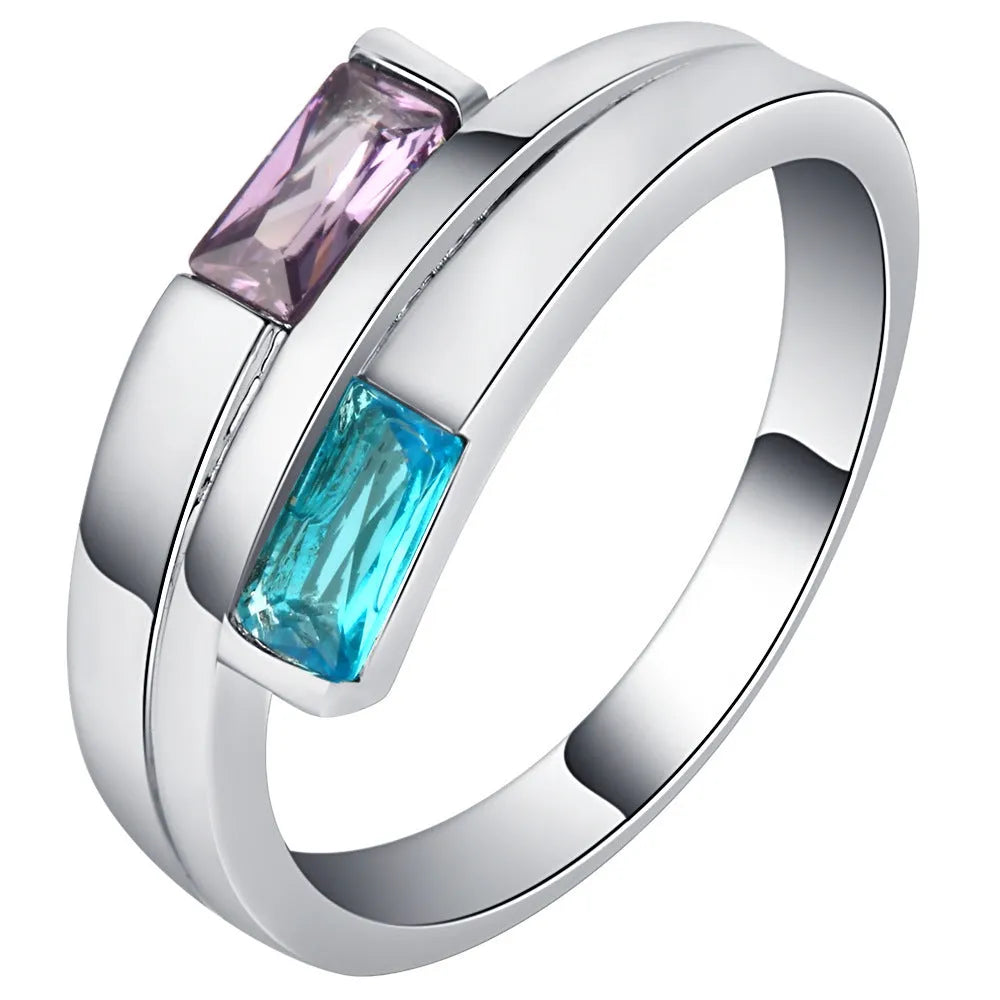 Silver electroplated copper ring with a zircon stone inlaid in the band.