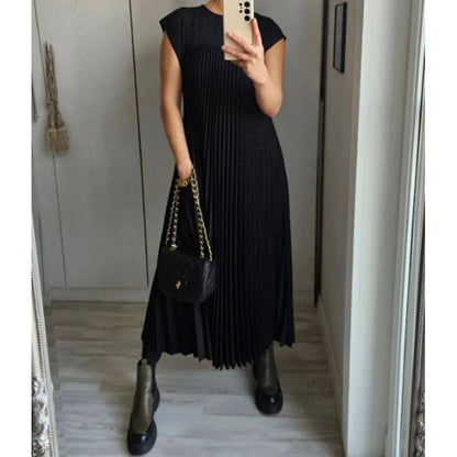 Women's summer pleated long dress in various colours, showcasing the unique design and flattering silhouette.