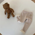 Girls solid colour fleece-lined leggings with high waist and hair band belt, shown in beige, black, brown, grey.
