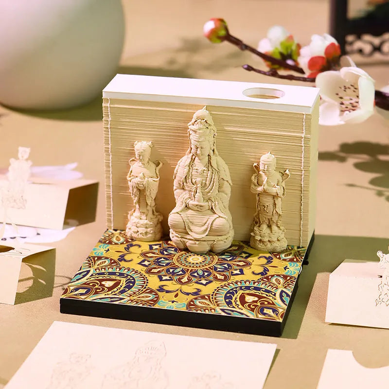 3D paper carving calendar 2026 showing Guanyin Bodhisattva and Sends Wealth Boy in seated lotus design, retro style