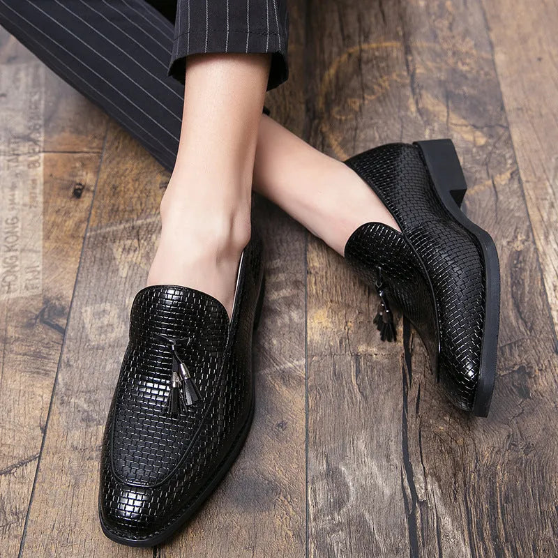 Men's black pointed slip-on shoes with tassel detail on a low-top PU upper