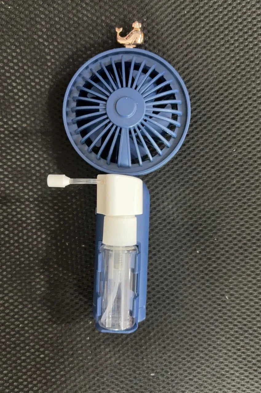 Plastic USB desk fan with adjustable nozzle in apricot colour on wooden desk