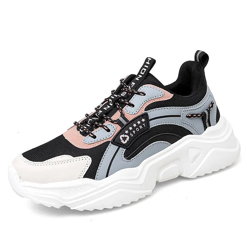 White women's casual sneaker with mesh upper, thick PU sole, buckle detail, and round toe.