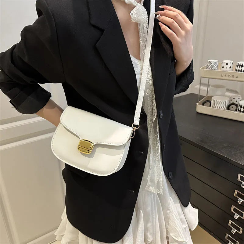 Simple PU leather women's handbag with interior zippered compartment and mobile phone pocket