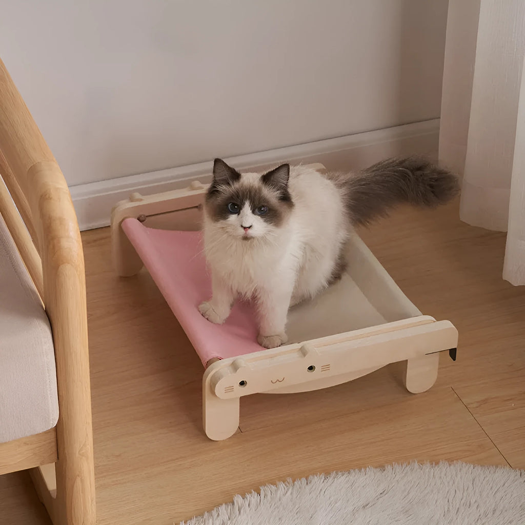 Solid wood raised pet bed with removable cushion in plaid pattern for cats and dogs