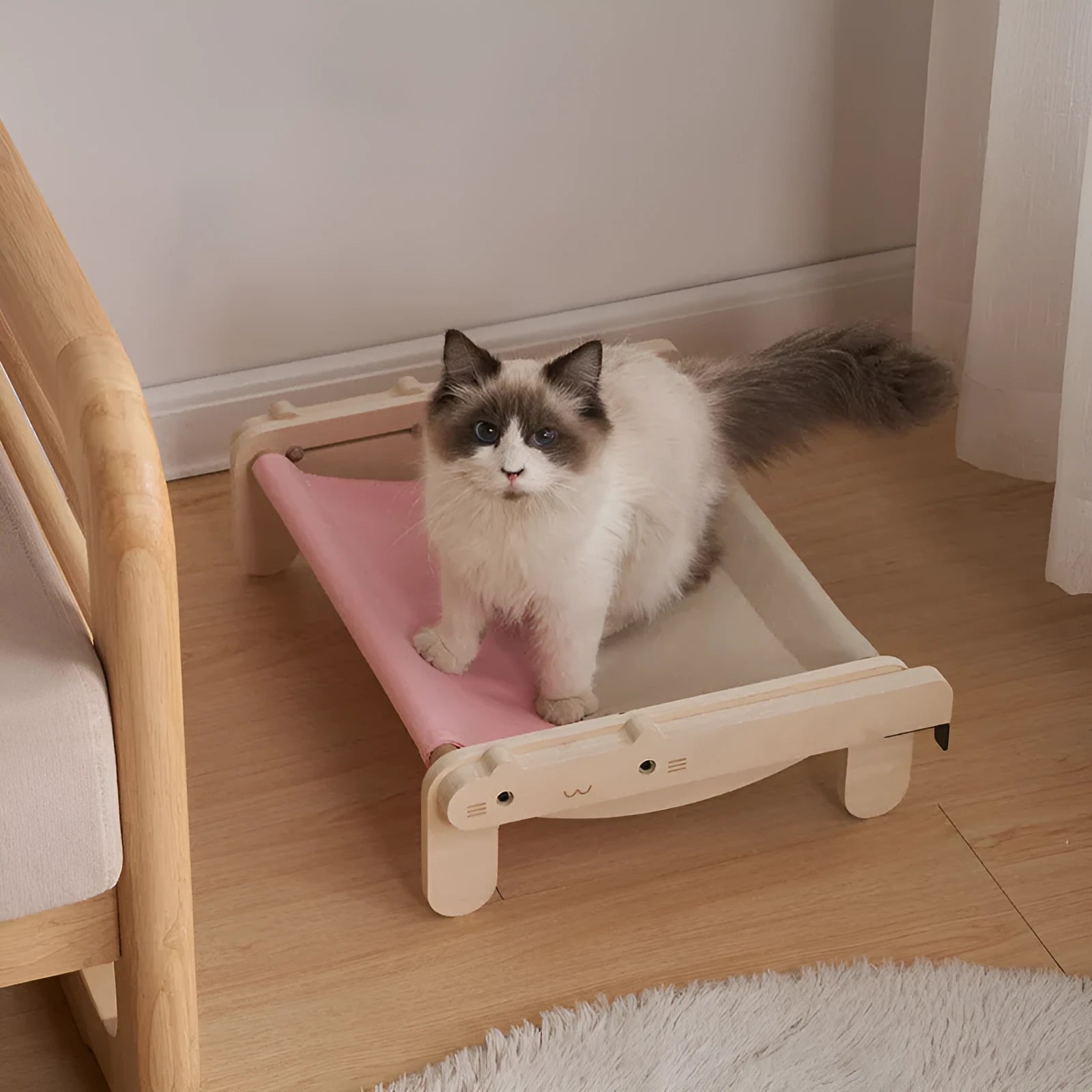 Solid wood raised pet bed with removable cushion in plaid pattern for cats and dogs