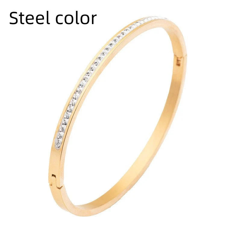 Single row stainless steel bracelet with diamond opening in gold, rose gold, or steel
