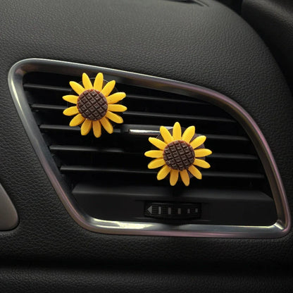 Yellow sunflower car vent perfume clip measuring 8cm with secure mounting clip for air freshening