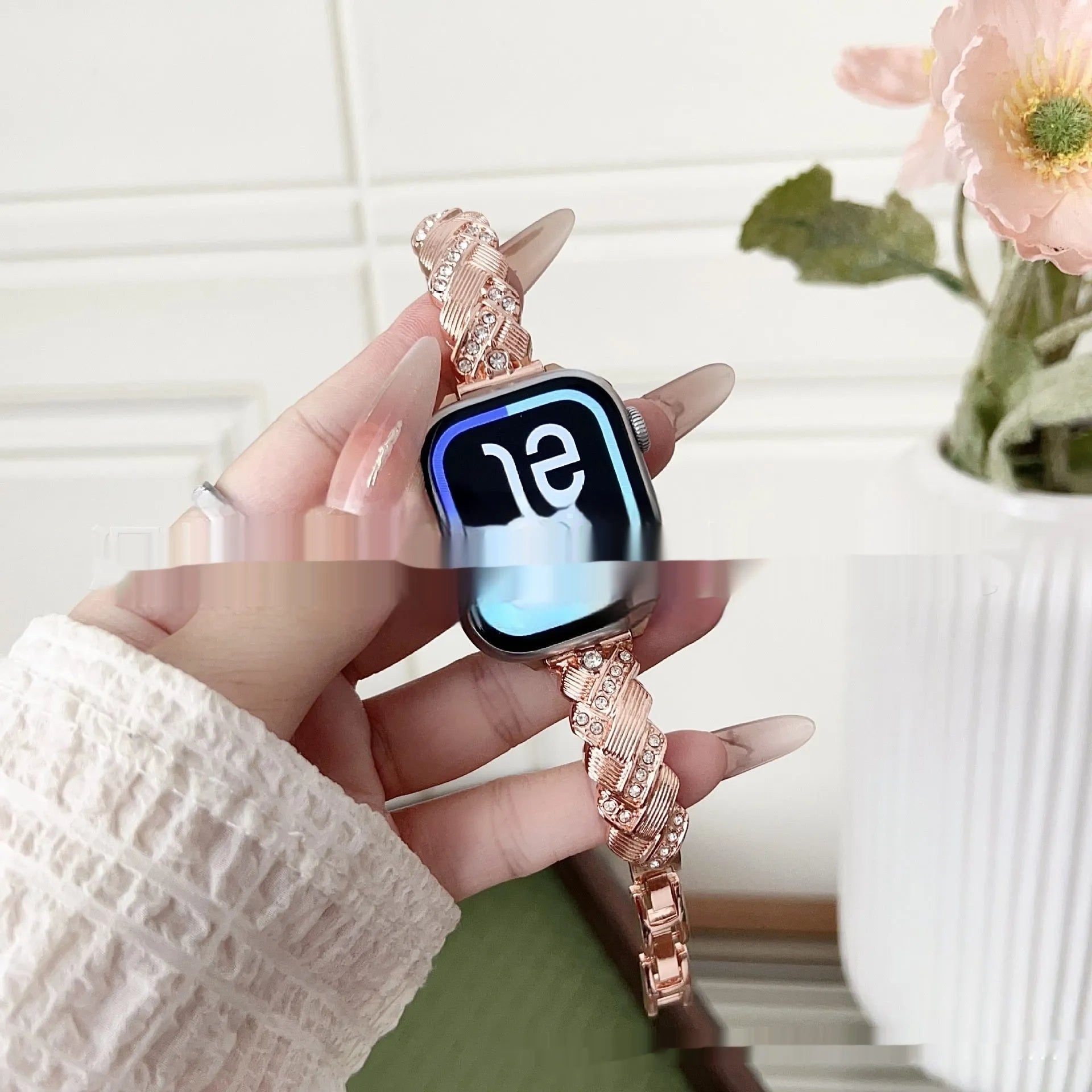 Zinc alloy metal Apple Watch band with twist and diamond design in silver, rose gold, gold, black, and Starlight colours.