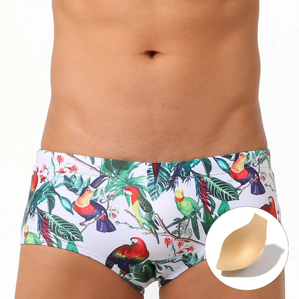 Men's floral bird print swim trunks with cup compartment in blue and white design