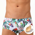 Men's floral bird print swim trunks with cup compartment in blue and white design