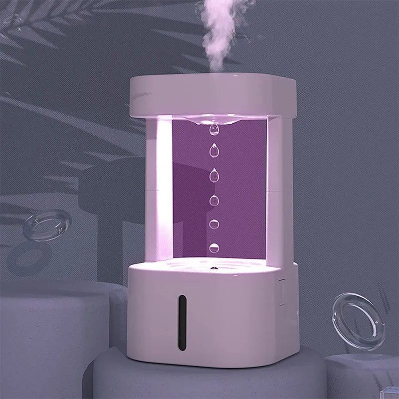 White anti-gravity water drop humidifier with coloured lights and USB cable