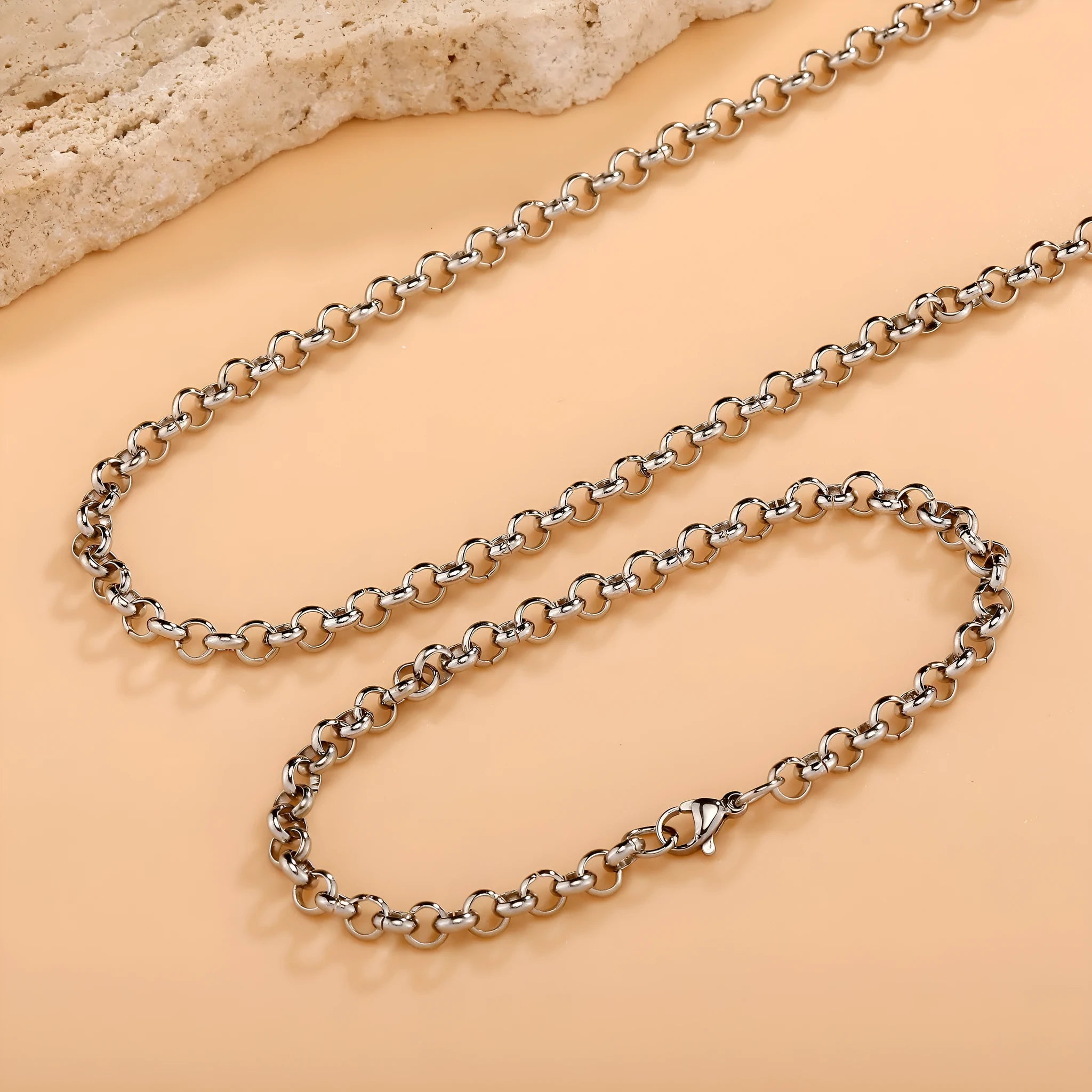 Silver stainless steel men's punk ring buckle necklace with O-ring chain on a neutral background