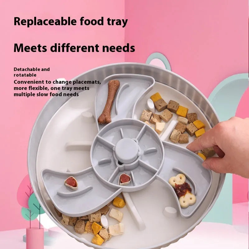 Rotating plastic pet food bowl with a blue silicone slow feed licking mat insert in a windmill pattern.